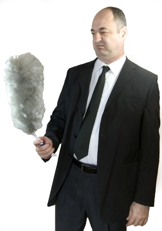 Portrait of senior business watching a feather dusterの写真素材