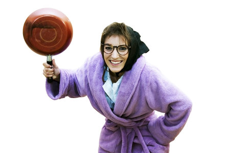 Old woman with frying panの写真素材