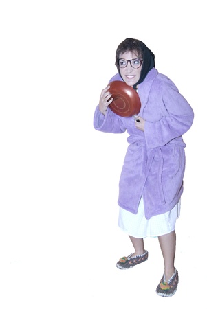 Old woman with frying panの写真素材