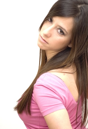 Portrait of young beautiful woman with pink shirt on white backgroundの写真素材