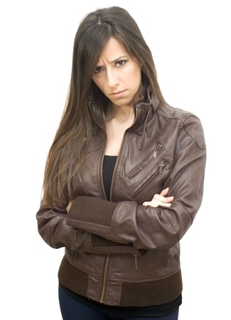 Portrait of the attractive brunette in a leather jacket on white backgroundの写真素材