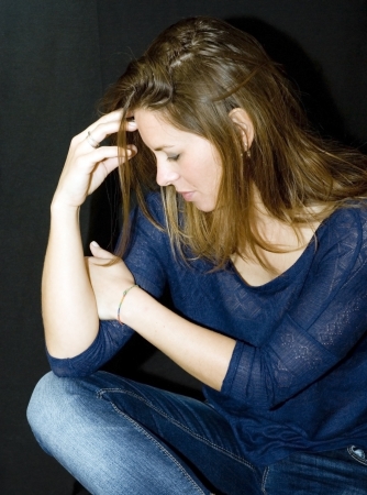 Portrait of beautiful young woman on black backgroundの写真素材