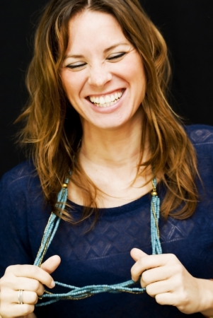 Portrait of young beautiful woman on black backgroundの写真素材