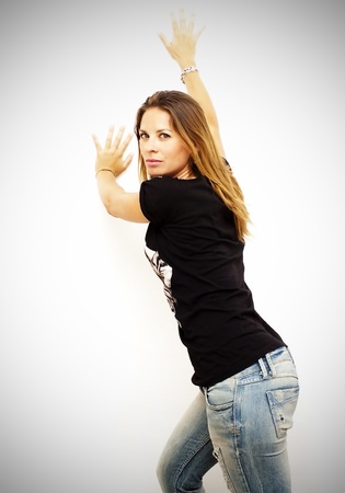 Portrait of young beautiful woman with black shirt on white backgroundの写真素材