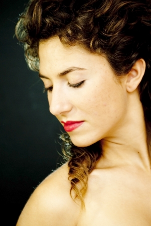 Portrait of an attractive woman on black backgroundの写真素材