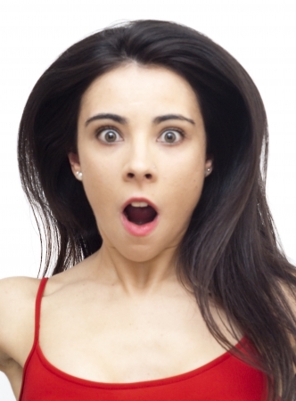 Portrait of a young  woman with red shirt screaming over white backgroundの写真素材