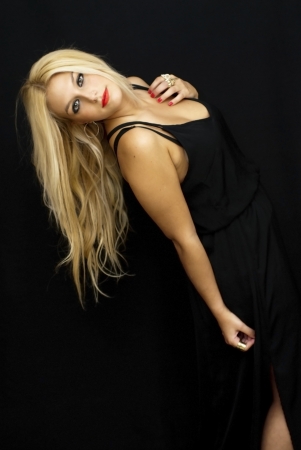 Wonderful blonde woman on black backgroundの写真素材