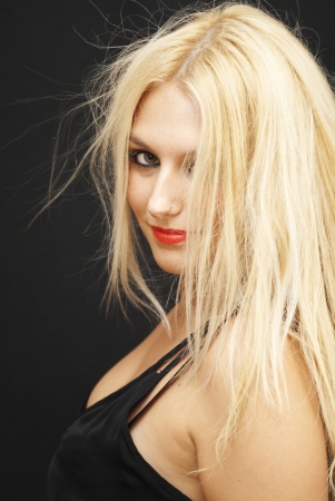Wonderful blonde woman on black backgroundの写真素材
