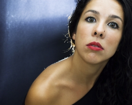 Backlit portrait of an attractive womanの写真素材