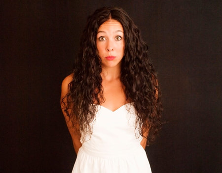 Wonderful latin woman with white dress on black background