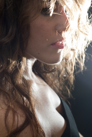 Backlit portrait of an attractive womanの写真素材