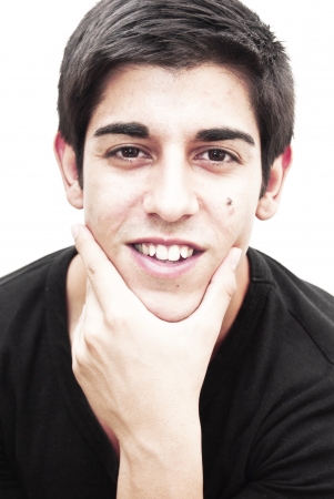 Handsome guy thinking with black shirt on white backgroundの写真素材