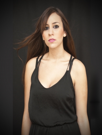 Beautiful Brunette Girl over black backgroundの写真素材