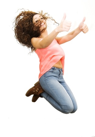 Beautiful Girl jumping over white backgroundの写真素材