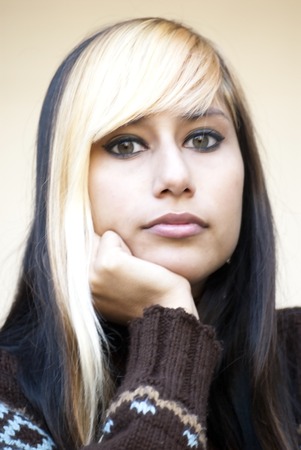 Beautiful Girl over wall backgrountdの写真素材