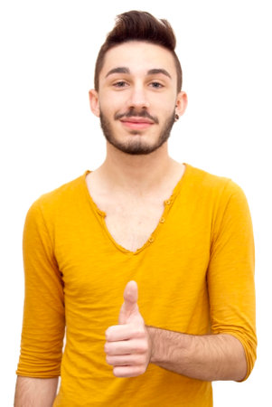 Handsome guy with beard and her thumb up on white backgroundの写真素材