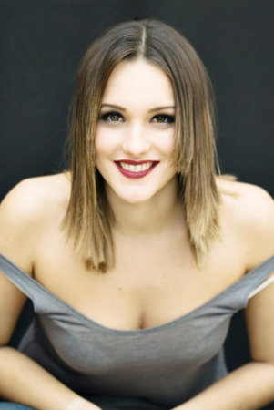 Beautiful Brunette Girl over black backgroundの写真素材