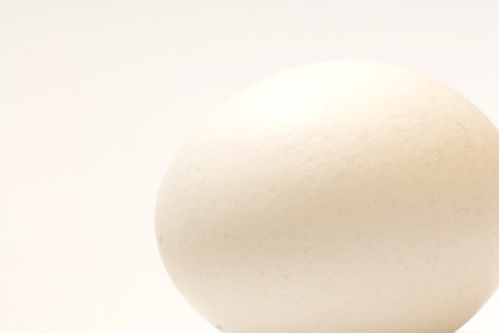 big white eggs over white backgroundの写真素材