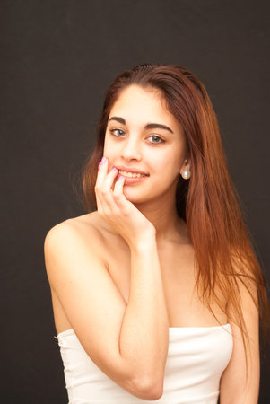 Beautiful girl with blue eyes over black background