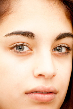 Beautiful girl with blue eyes over black background