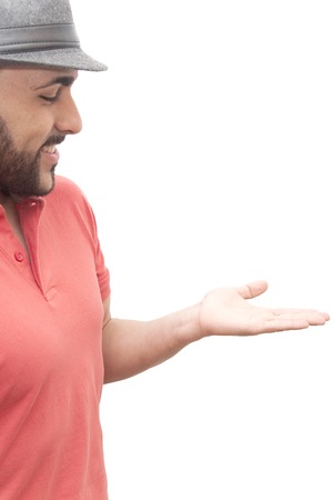 handsome guy with beard, hat and open hand on white backgroundの写真素材