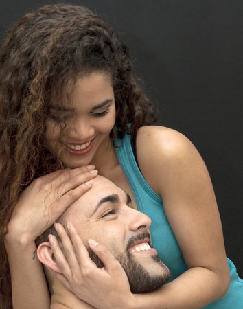 Young couple in love on black backgroundの写真素材
