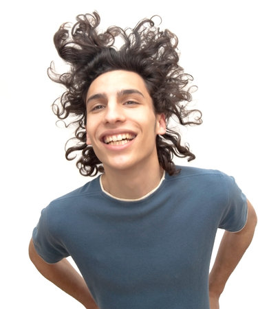 Handsome man moving her hair over white background