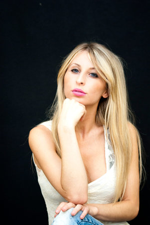 Portrait of Beautiful Blonde Woman Over Black Background