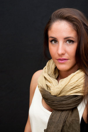 Portrait of Beautiful Young Woman Over Black Background