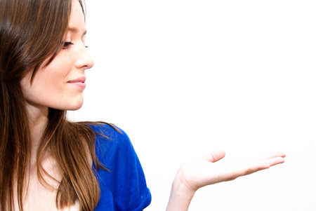 Portrait of Beautiful Young Woman  With His Open Hand Over White Backgroundの写真素材