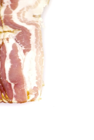 Slices of bacon on white background の写真素材