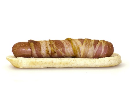 Hot dog with bacon on a white background の写真素材