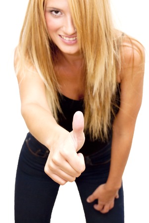 Portrait of Beautiful Blonde Woman  With The Thumb Upwards Over White Backgroundの写真素材
