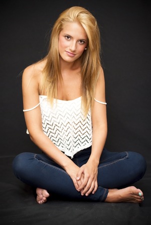 Portrait of Beautiful Blonde Woman Over Black Backgroundの写真素材