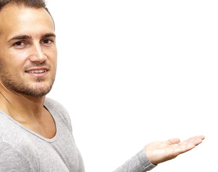 Handsome man with his open hand over white backgroundの写真素材