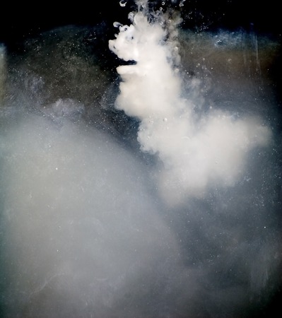 Milk jet simulating a colorful galaxy full of starsの写真素材