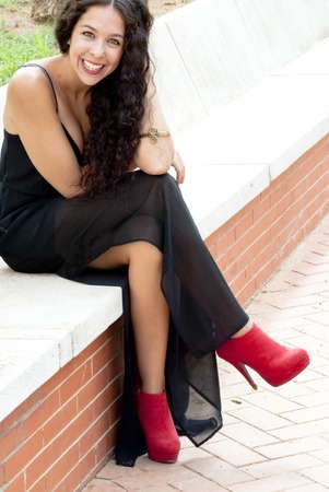 Beautiful woman in a park on a sunny dayの写真素材