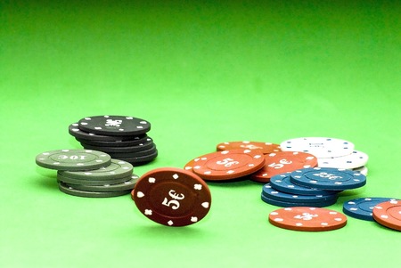 Poker chips over green backgroundの写真素材