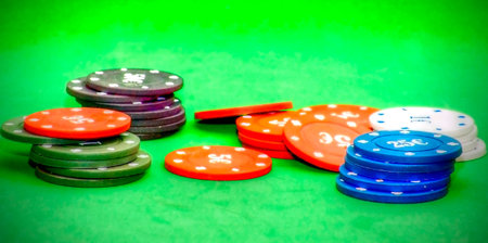 Poker chips over green background
