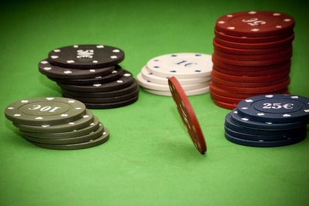 Poker chips over green backgroundの写真素材