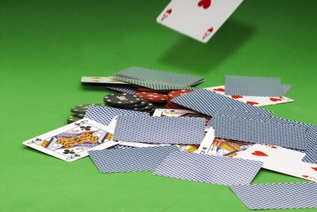 Cards and gambling chips over green backgroundの写真素材