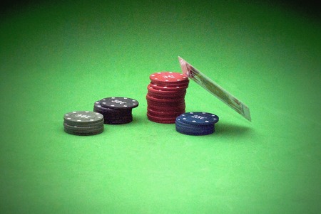 Cards and gambling chips over green backgroundの写真素材