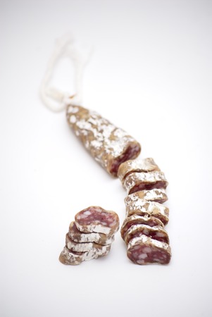 Spanish pork sausage over white backgroundの写真素材