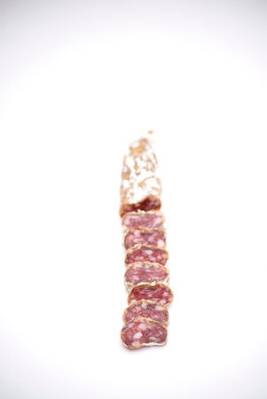 Spanish pork sausage over white backgroundの写真素材