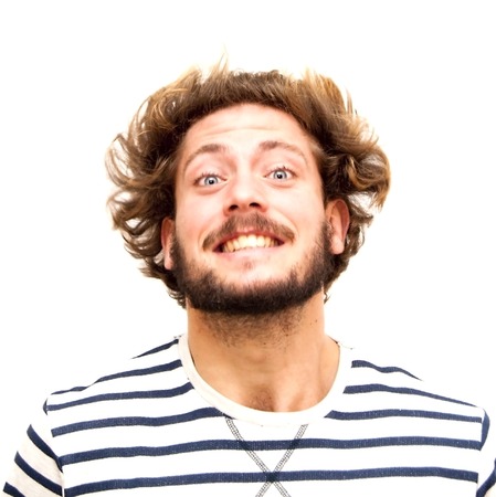 Handsome man Shaking Her Hair over white backgroundの写真素材