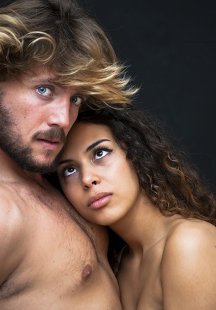 Beautiful portrait of a loving couple  on black background.の写真素材