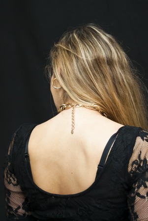 Portrait of Beautiful Young Woman Over Black Backgroundの写真素材