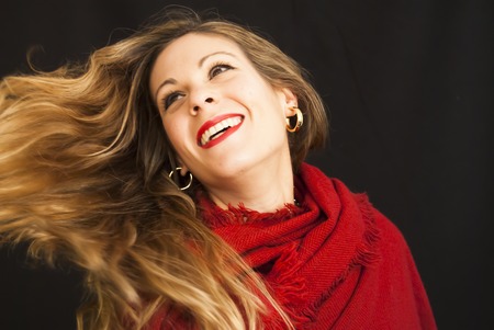 Portrait of Beautiful Young Woman Over Black Backgroundの写真素材