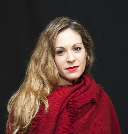 Portrait of Beautiful Young Woman Over Black Backgroundの写真素材