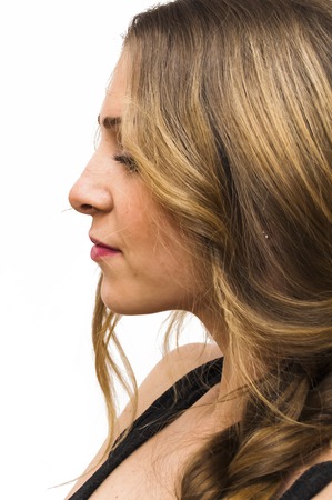 Portrait of Beautiful Young Woman Over White Backgroundの写真素材